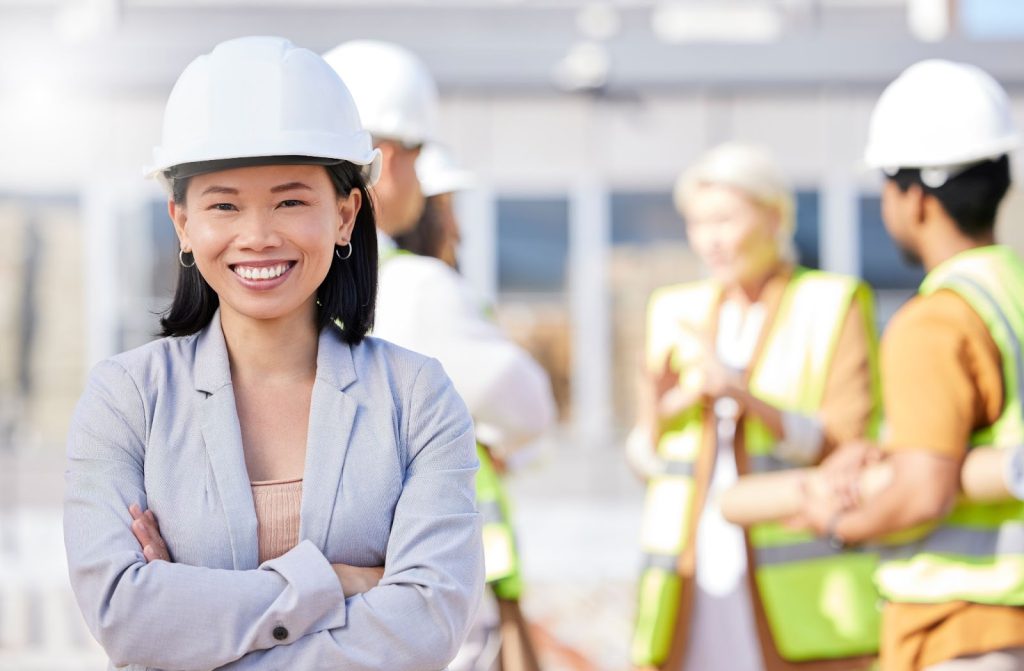 A female engineer with other construction workers on site.