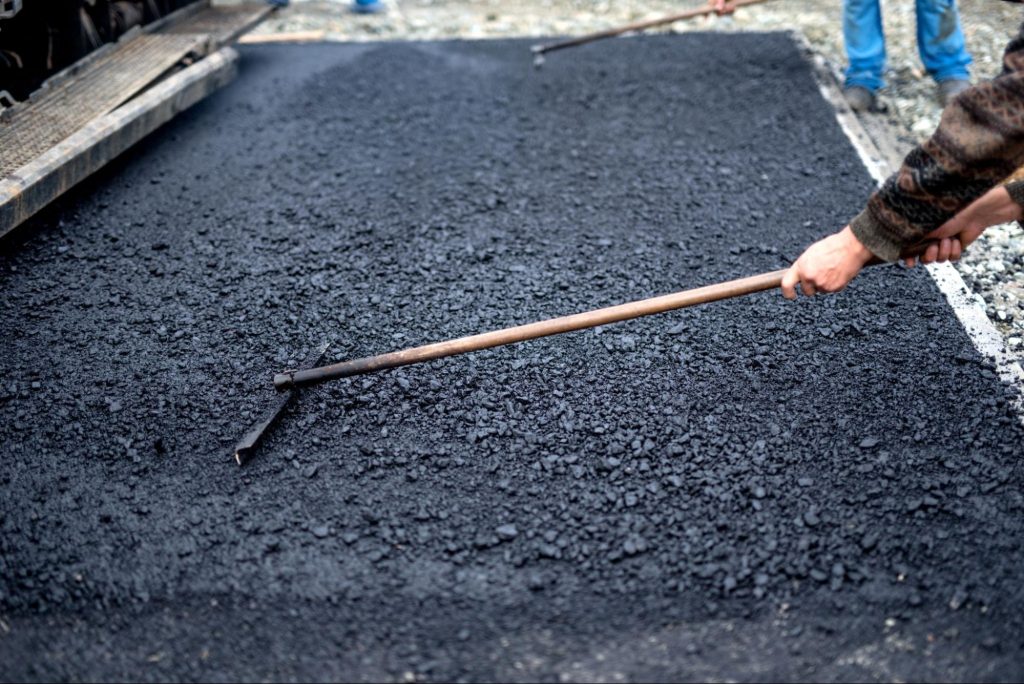 Man working with asphalt.