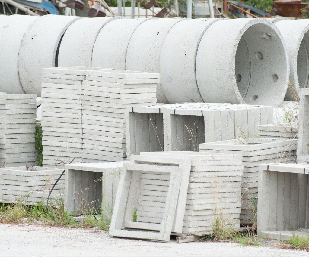 A close-up image of prefabricated concrete pieces of various types and shapes that are ready for discharge.