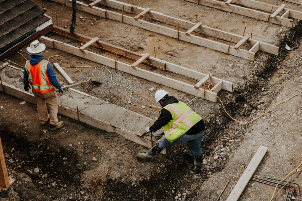 Construction workers working with concrete. 